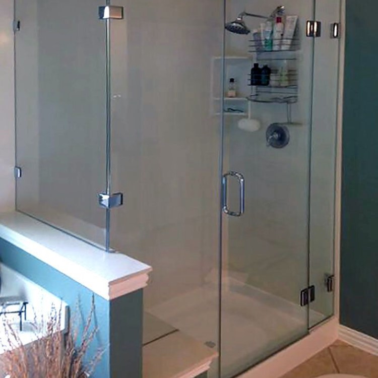 Frameless corner glass shower enclosure with inset glass shelves