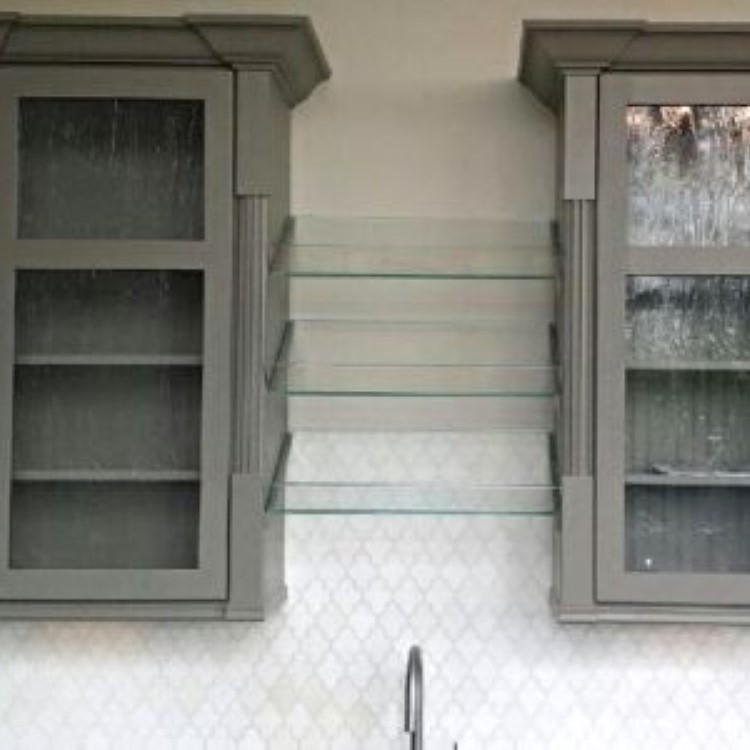 Glass inserts fitted into painted kitchen cabinet doors
