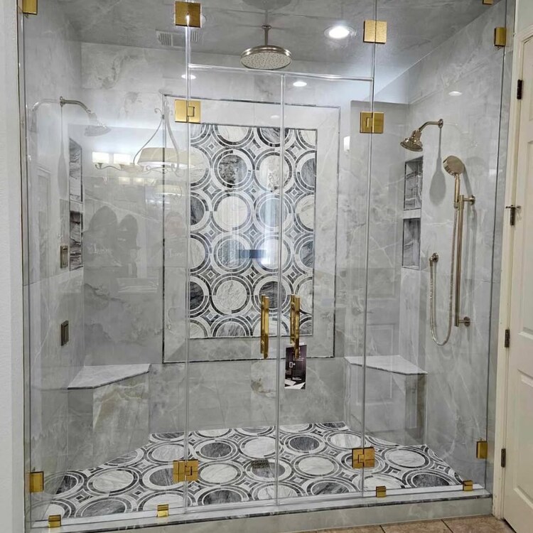Frameless steam shower with two glass entry doors and a tiled bench