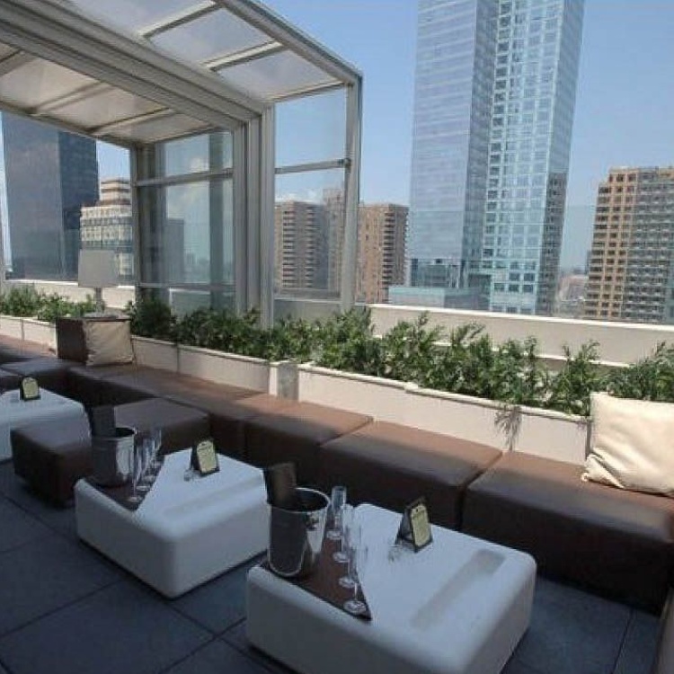 Rendering of a rooftop seating area with glass wind screens