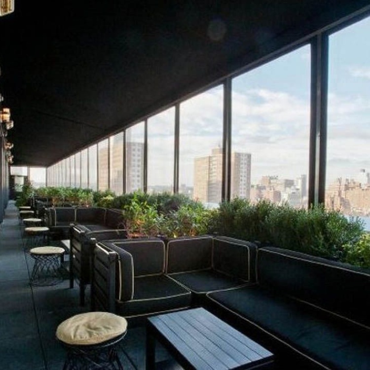 Rendering of a rooftop terrace with planters and glass guards