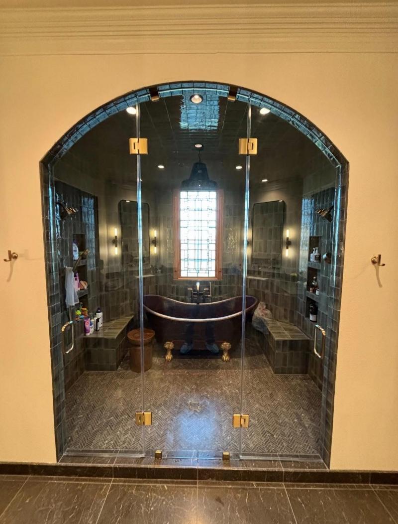 Arched floor-to-ceiling 3-piece inline shower enclosure with double doors in Austin, TX