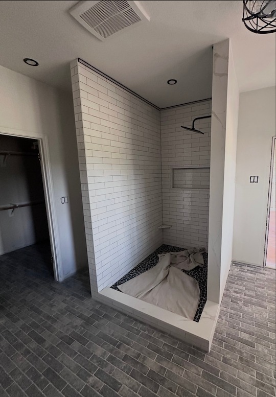 Manchaca, TX shower opening with the tile finished, before the glass was installed
