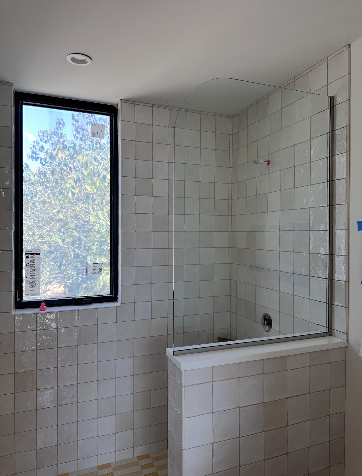 Second view of the radius-corner splash panel on a pony wall in Austin, TX