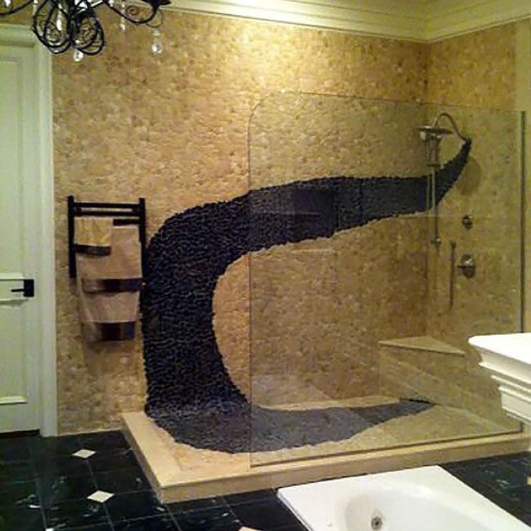 Curved frameless glass shower screen at a walk-in shower