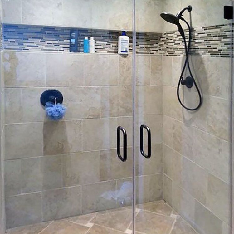 Double inline frameless glass shower enclosure with two entries