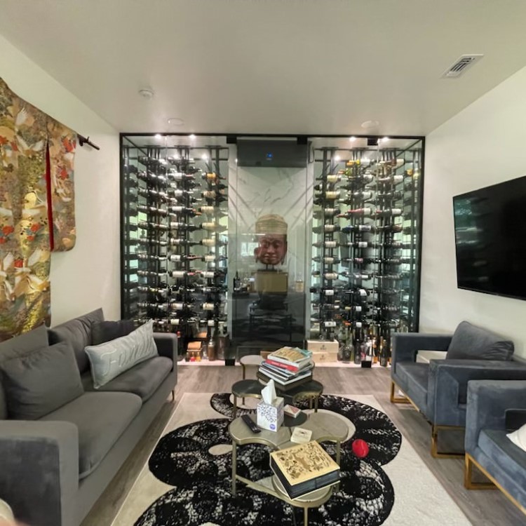 Glass-walled wine cellar built into a living space