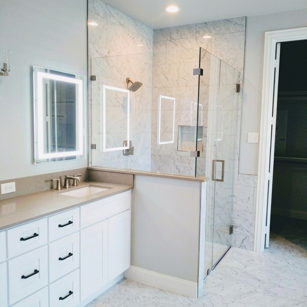 Shower glass enclosure in a newly built Austin-area home bathroom